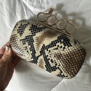 Elegant Snake Print Clutch with Gold Accents